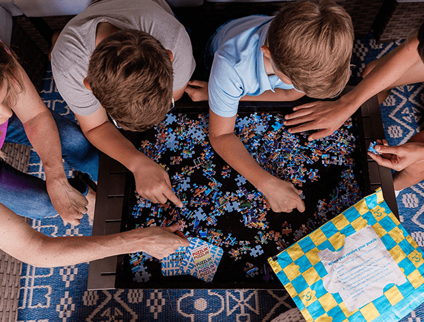 Family enjoying puzzle together